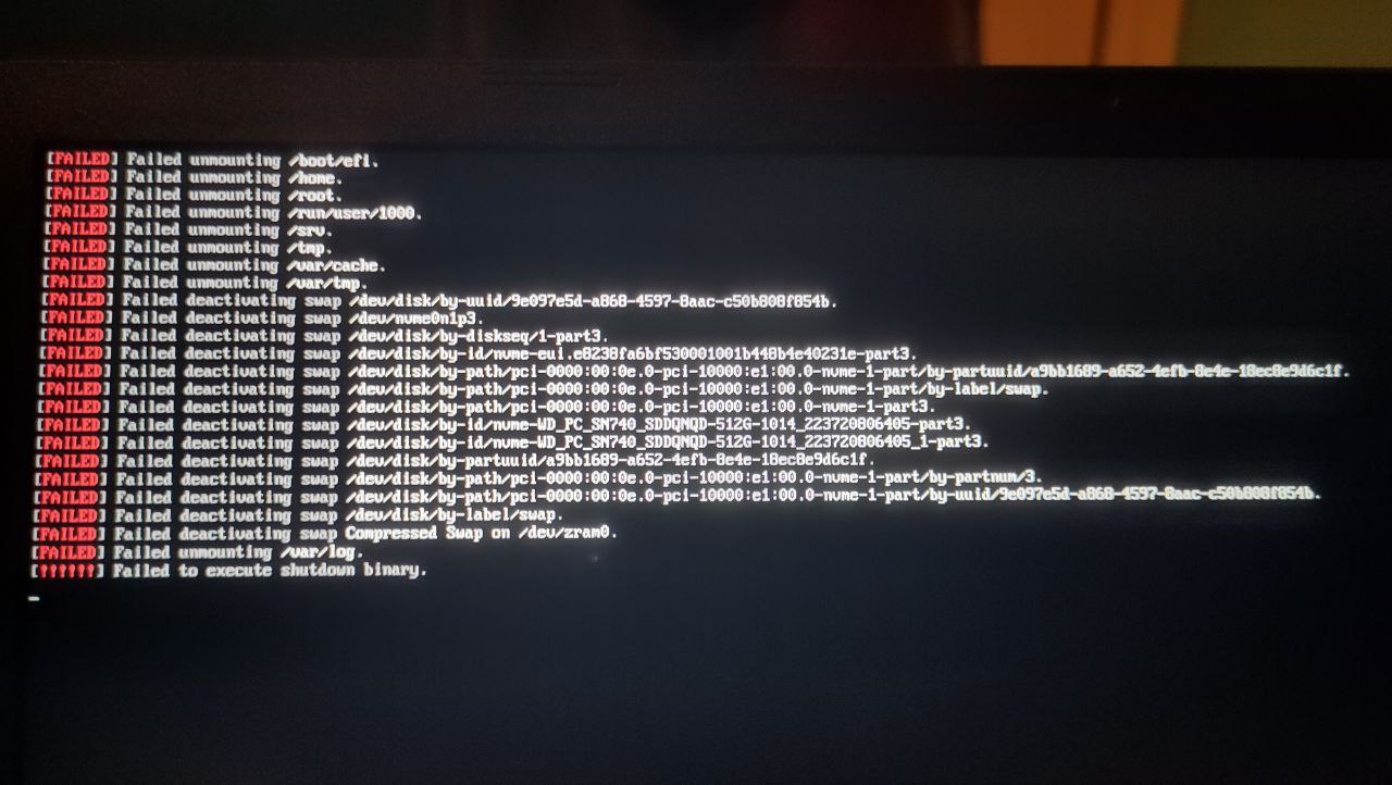 A picture of my laptop’s screen, showing a black screen with white and red text. Various errors are displayed, prefaced with large red text reading “FAILED”, all related to the laptop shutting down.